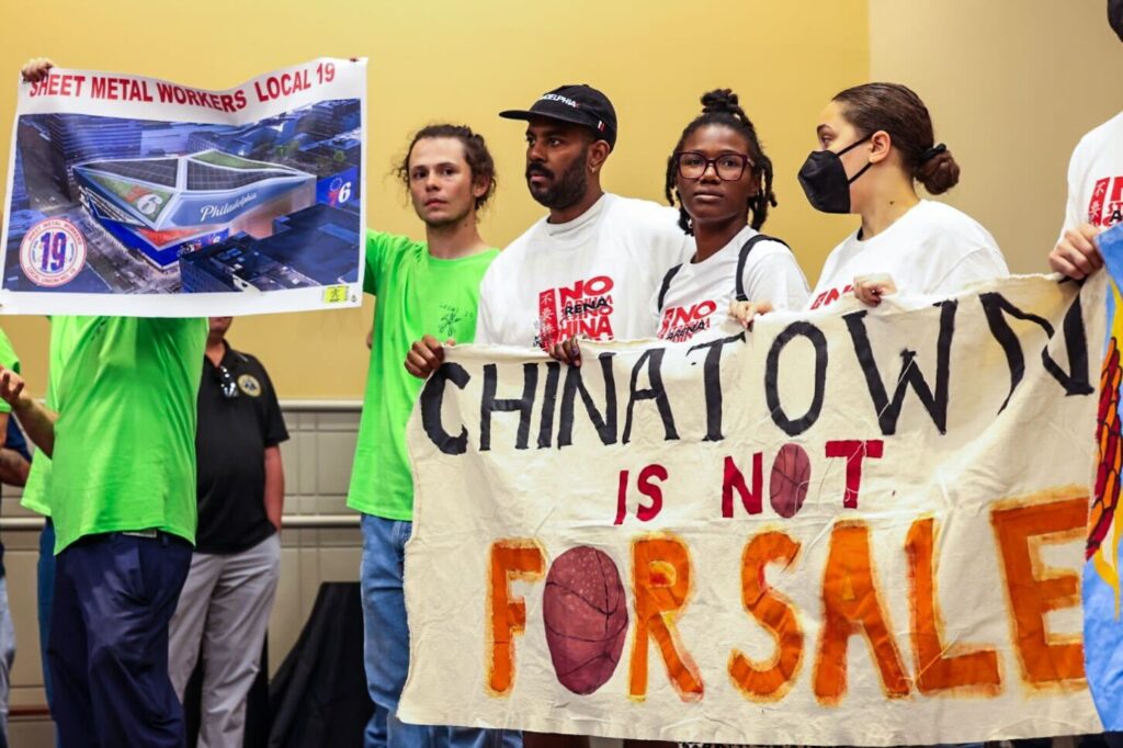 parker-chinatown-arena-k-paynter-2024-09-11-3 People holding up a sign that says 'Chinatown is not for sale'