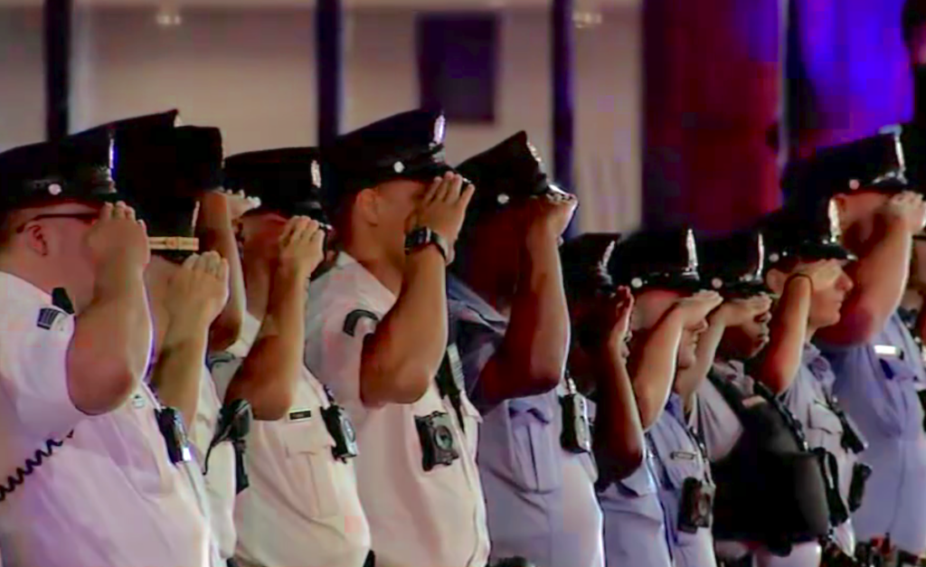 Police officers saluting