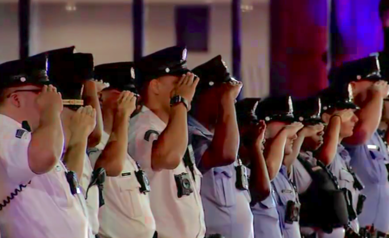 Police officers saluting