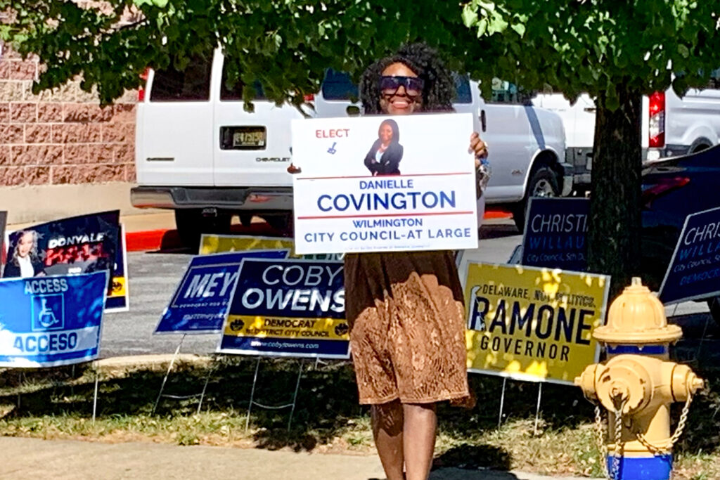 polling-place-wilmington-s-mueller-2024-09-10-3 Woman holding a campaign sign for Danielle Covington