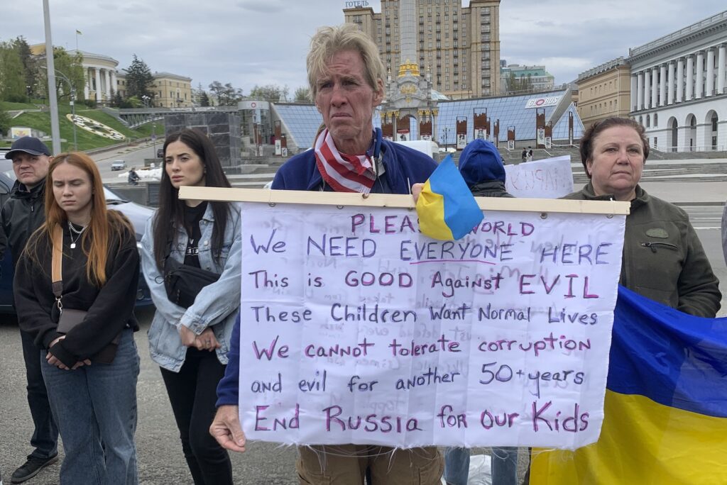 US Election 2024 Trump Suspect Ryan Wesley Routh holds up a banner during a rally in central Kyiv, Ukraine