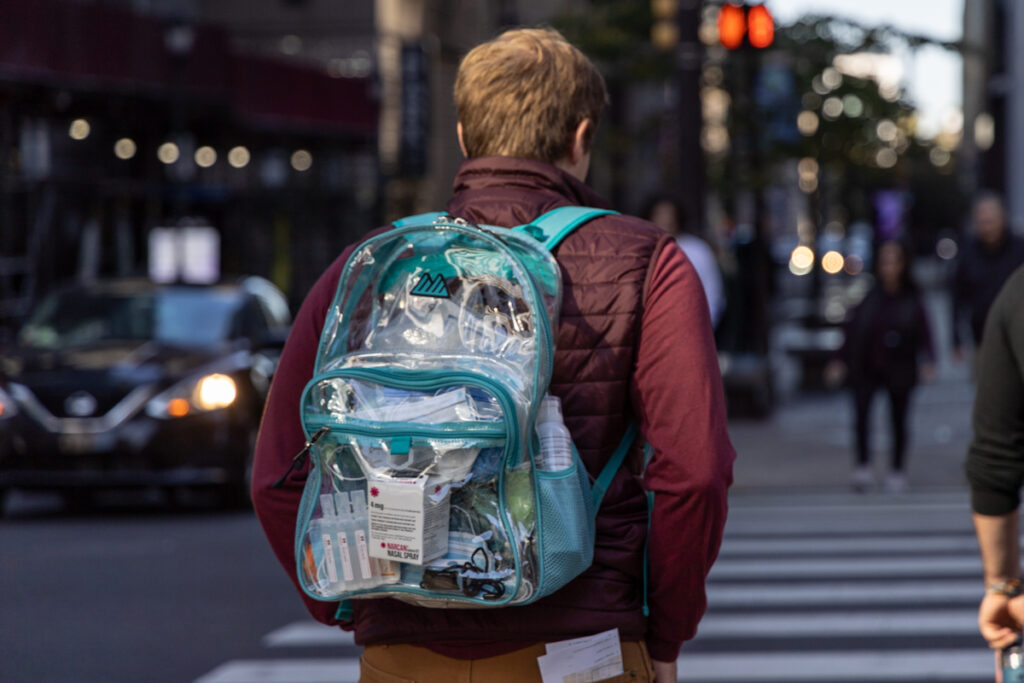 10 19 2024 k paynter outreach homeless opiod epidemic-3 a person carrying a clear bag with first aid items
