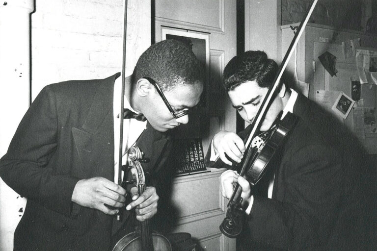 Alfred Brown and Joseph Silverstein practicing violin