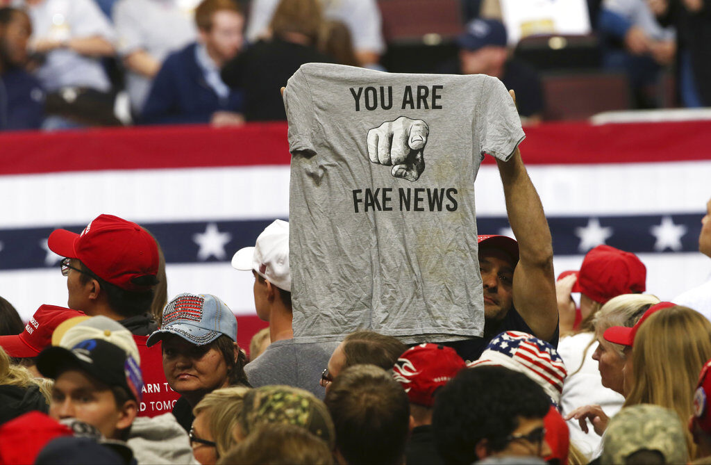 Election 2018 Trump A Trump supporter holds up a T-shirt blasting