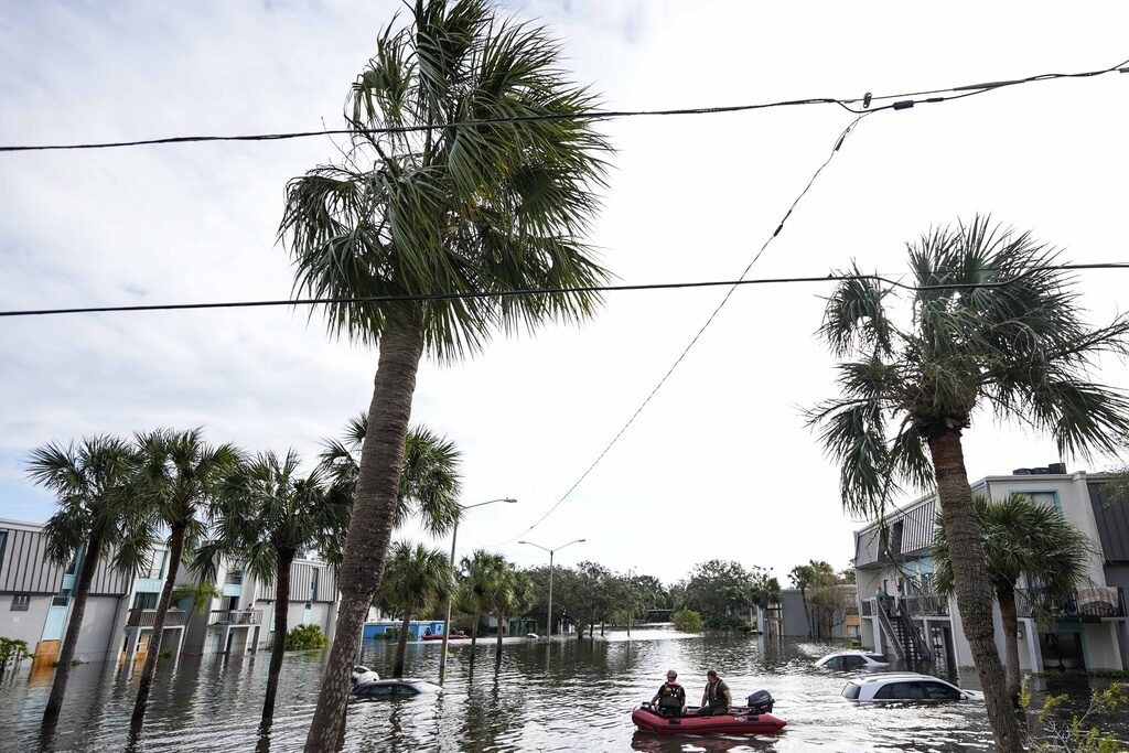 A water rescue boat floats in floods left after Hurricane Milton in Florida