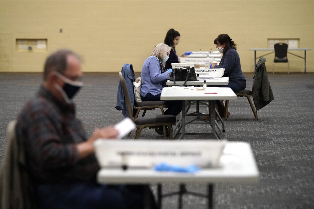 Election 2024 Pennsylvania Voting FILE - Workers prepare mail-in ballots for counting, Nov. 4, 2020, at the convention center in Lancaster, Pa. (AP Photo/Julio Cortez, File)