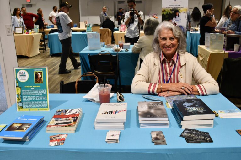 Dr. Concha Alborg at a booth