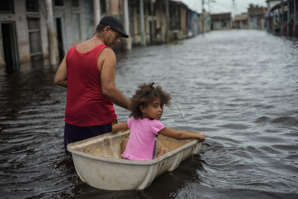 Unusual Hurricane Season Jesus Hernandez guides granddaughter