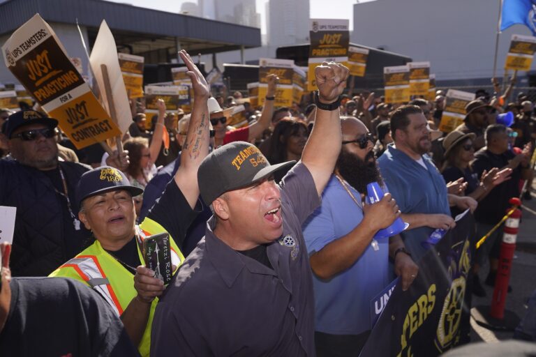 Teamsters and workers hold a rally