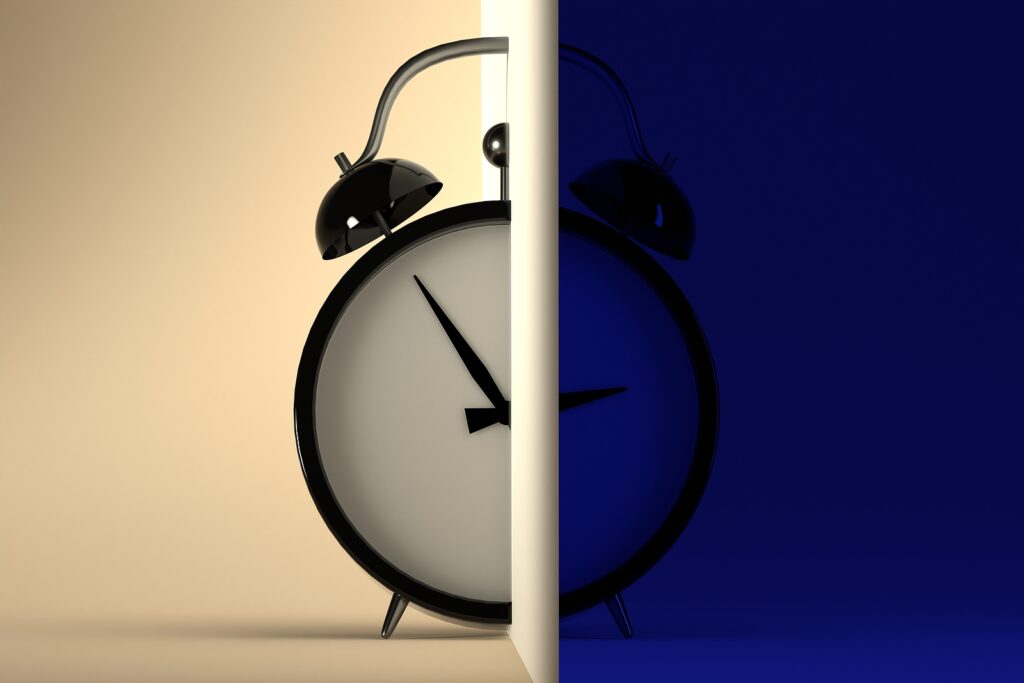 Circadian Rhythm Concept. Alarm Clock Divided Into Two Parts Wit Circadian rhythm concept. alarm clock divided into two parts with day and night.