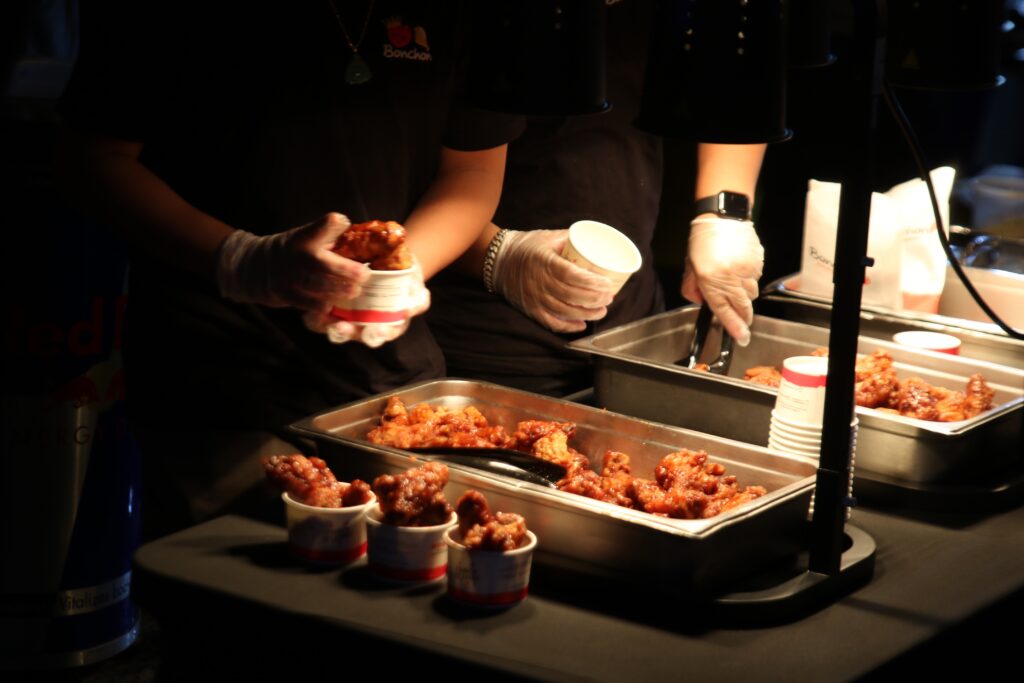 chinatown-night-market-2024-3 BonChon chicken being placed into cups