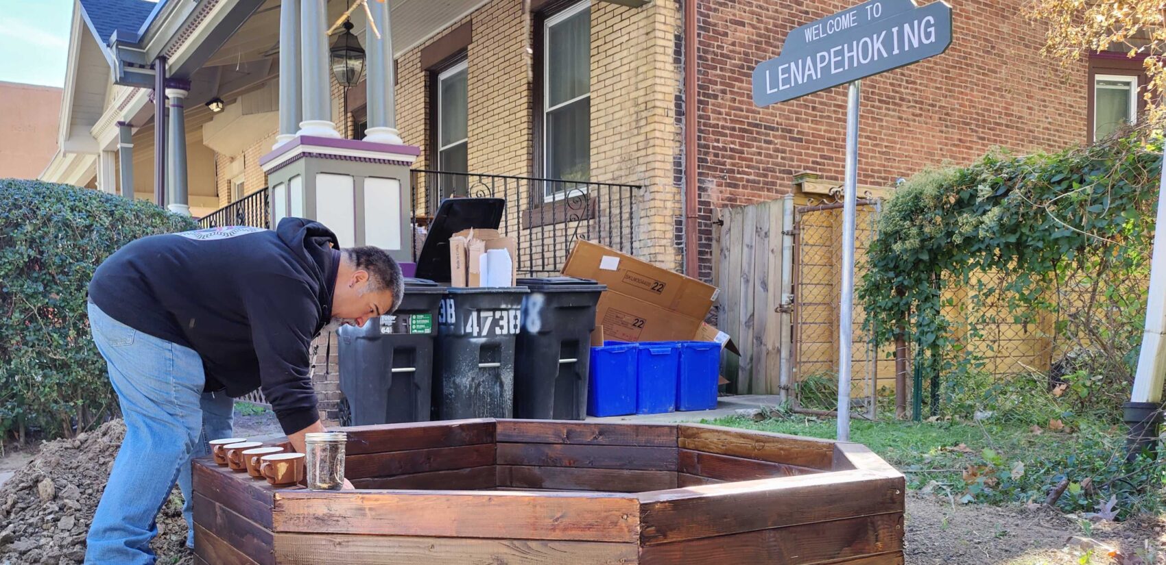 Tim Martin adds dirt to the raised bed