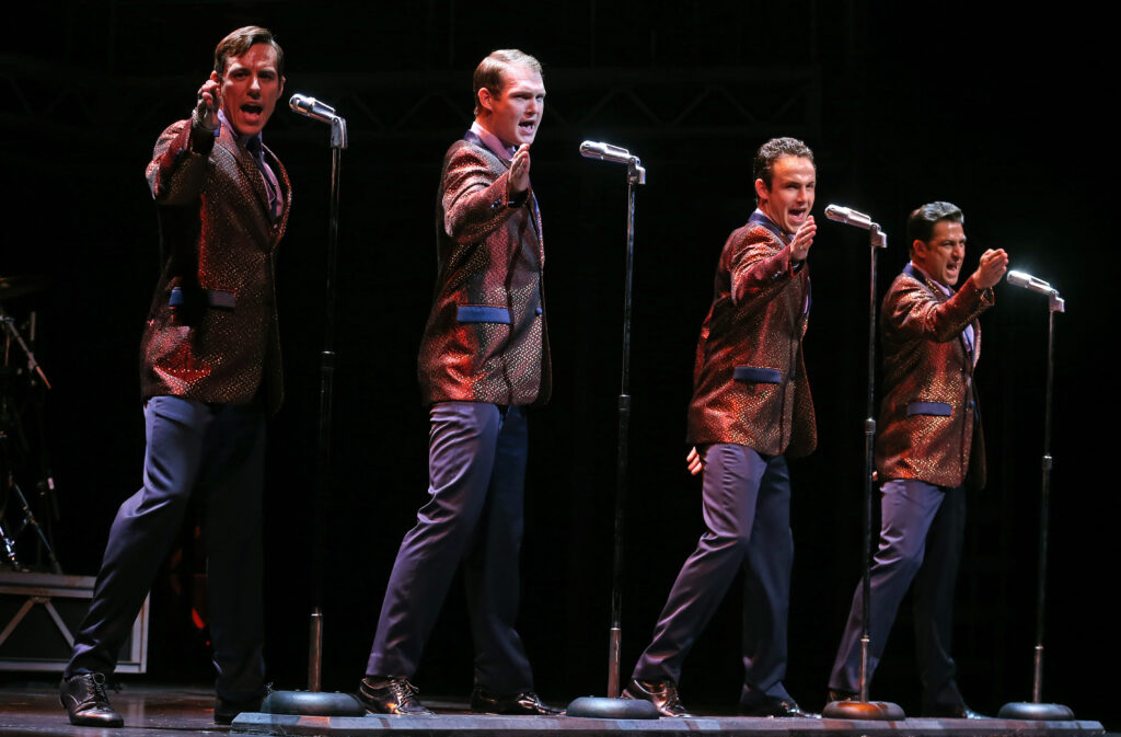 Four actors sing