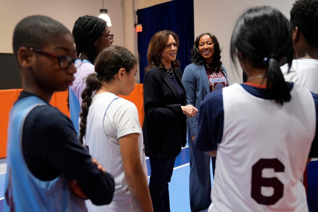 Kamala Harris speaks with youth basketball players