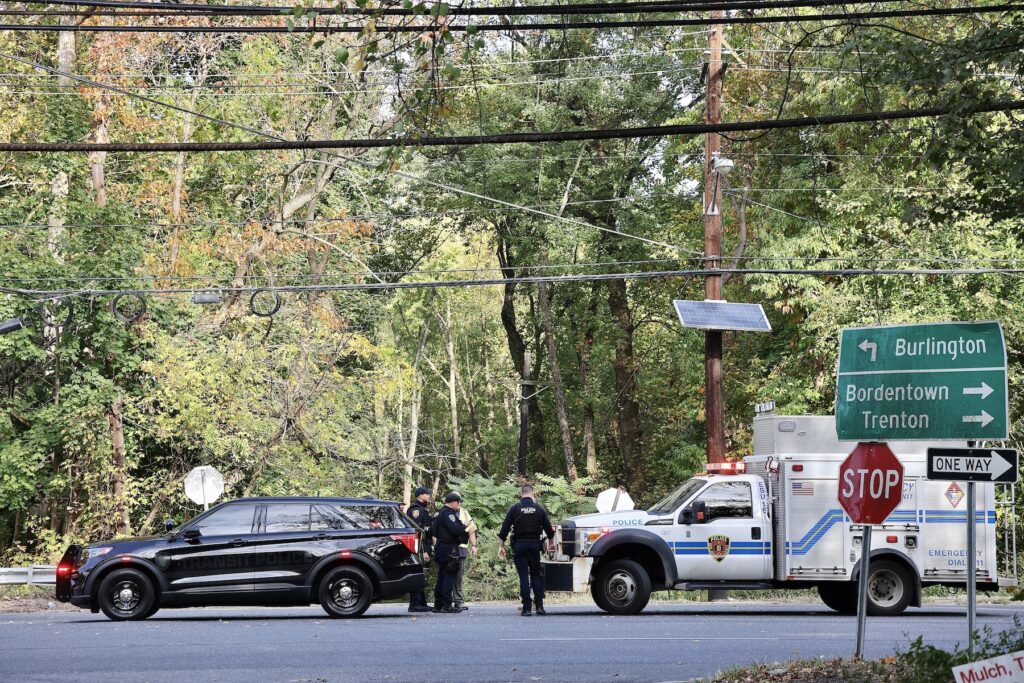 Police and emergency workers gather