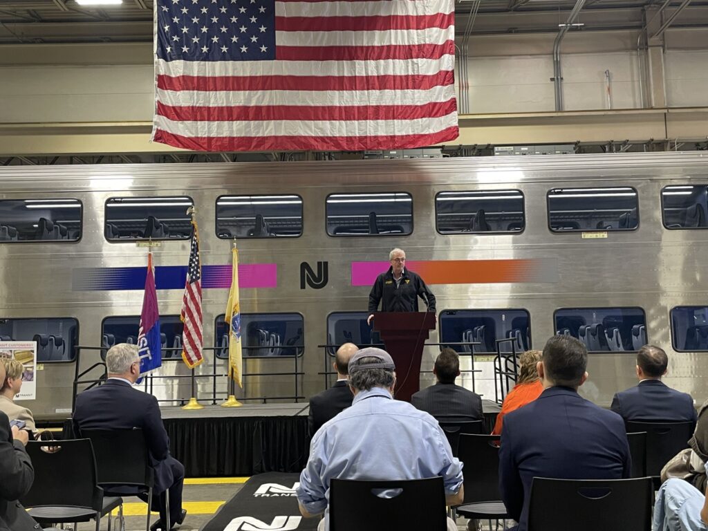 Murphy speaking in front of the new rail car