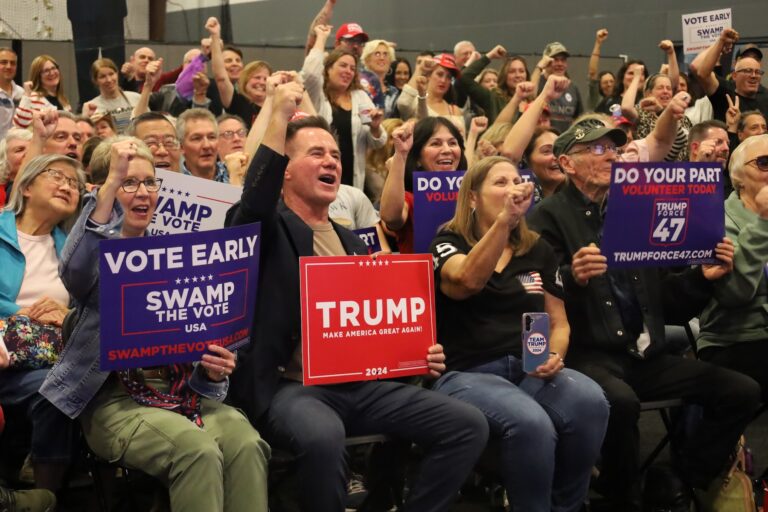 People sitting in the audience cheering