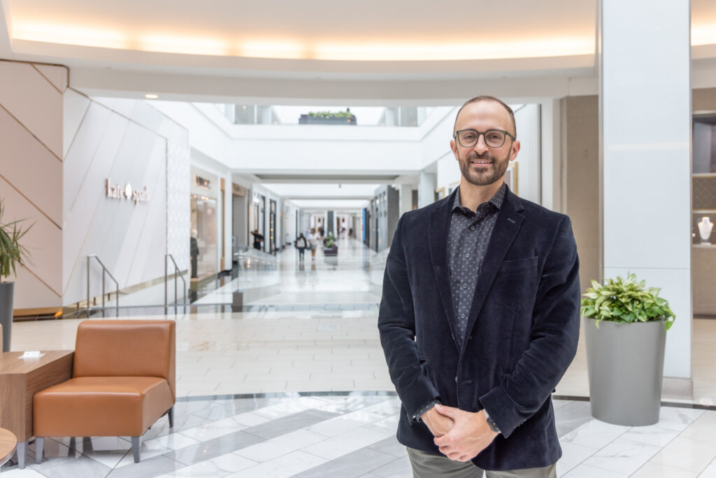 Todd Putt posing for a photo inside the mall