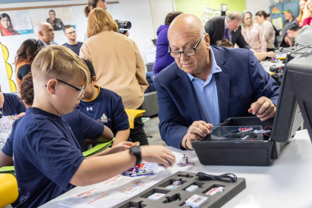 11 20 2024 k paynter cal ripken senior stem center tinicum school-7 Cal Ripken Jr., baseball Hall of Fame shortstop, helps a Tinicum School student with a STEM activity at the school’s new STEM center, donated by the Cal Ripken Sr. Foundation on November 20, 2024. (Kimberly Paynter/WHYY)