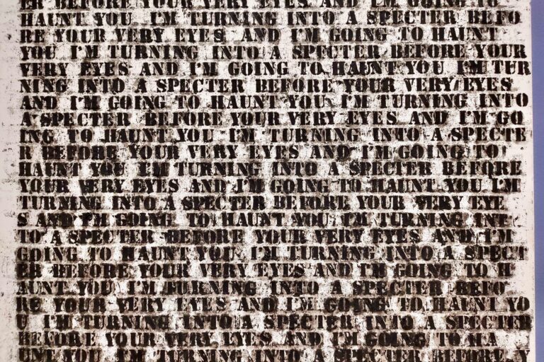 A detail of Glenn Lligon's ''Untitled'' (1992), in which he repeats the phrase ''I'm turning into a specter before your very eyes and I'm going to haunt you'' over and over in increasingly blurred and disintegrated text until it becomes undecipherable. (Peter Crimmins/WHYY)