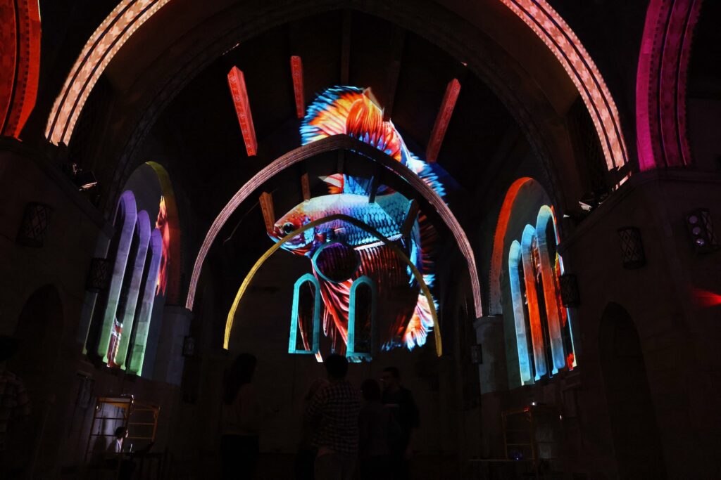 2024 11 01-e lee-philadelphia east falls thomas jefferson university ravenhill chapel-immersive light experiment fish A fish swims through the vault of Ravenhill Chapel