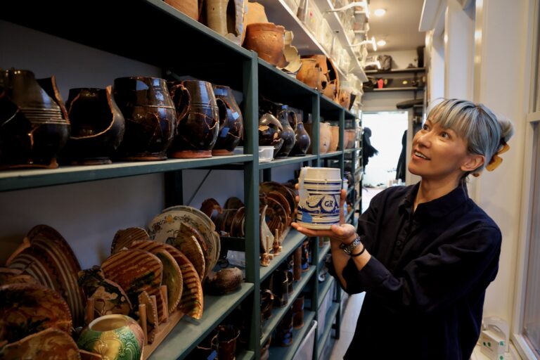 Since discovering two pre-Civil War privy pits beneath her home on Callowhill Street, Melissa Dunphy has amassed thousands of pieces of pottery and other artifacts. (Emma Lee/WHYY)