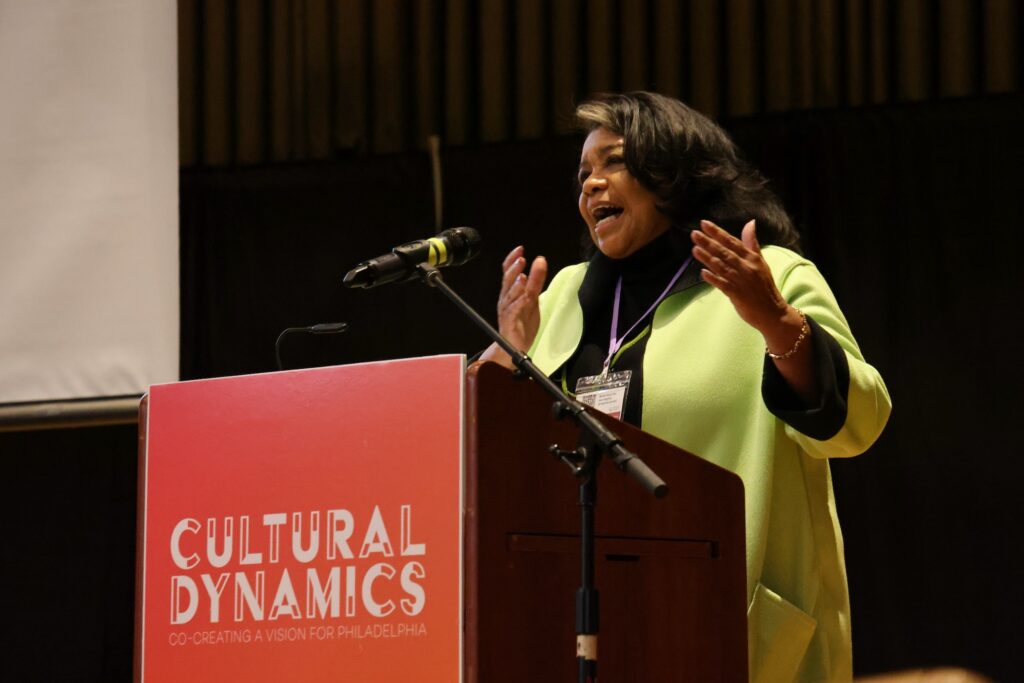 Patricia Wilson Aden speaks behind a podium