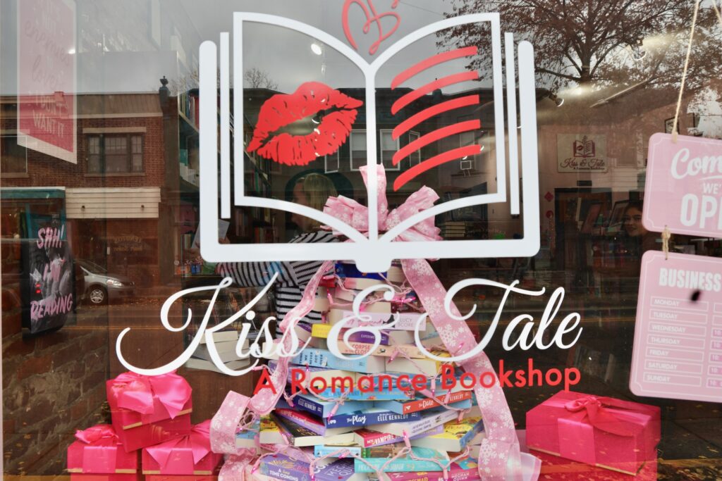 the window reads Kiss and Tale A Romance Bookshop