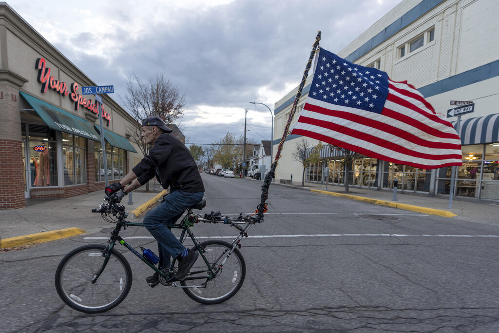 Election 2024 Michigan U.S. Army veteran, Doug Sherrill, 63, bikes to a polling site to vote for the first time in his life, Tuesday, Nov. 5, 2024, in Hamtramck, Mich. (AP Photo/David Goldman)