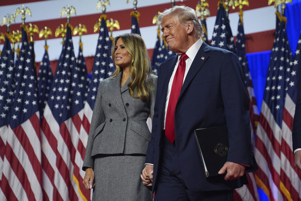 Election 2024 Trump Republican presidential nominee former President Donald Trump stands with former first lady Melania Trump at an election night watch party at the Palm Beach Convention Center, Wednesday, Nov. 6, 2024, in West Palm Beach, Fla. (AP Photo/Evan Vucci)
