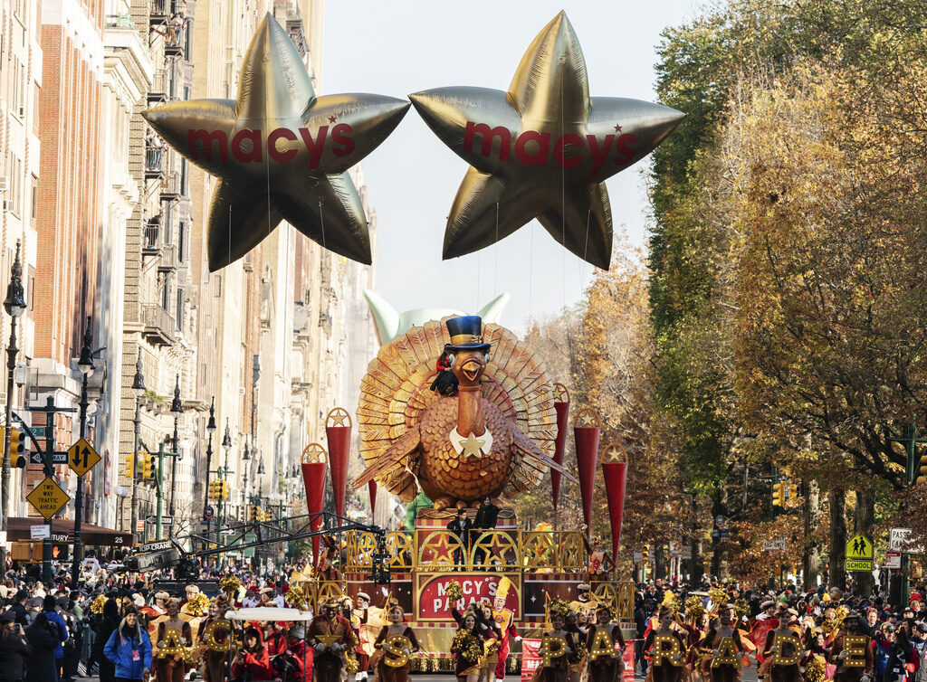 Thanksgiving Parade-How to Watch FILE - The Tom Turkey float leads the way down Central Park West during the Macy's Thanksgiving Day Parade on Nov. 24, 2022, in New York. (AP Photo/Jeenah Moon, File)