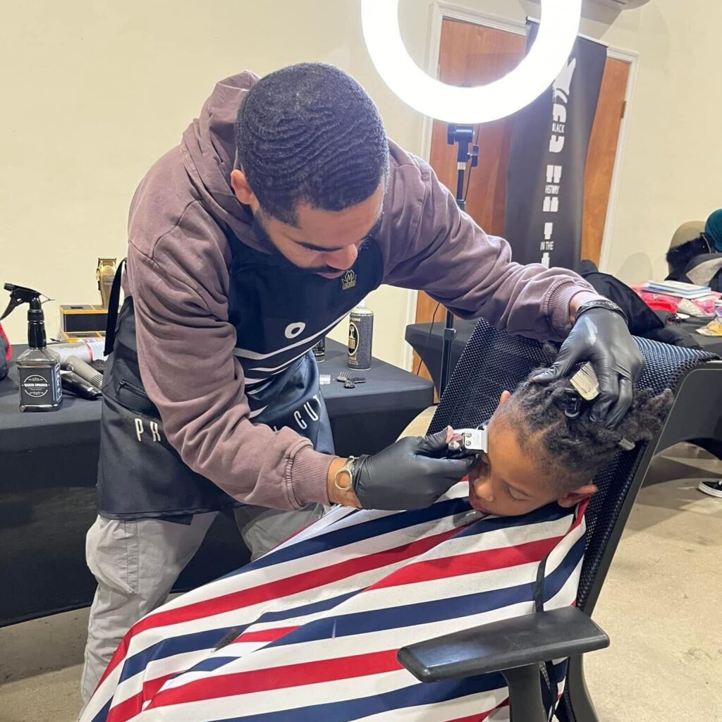 Adam Fair giving a haircut Adam Fair giving a haircut