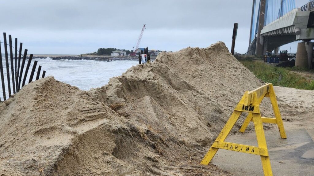 Indian River dune repair Workers repairing eroded dunes