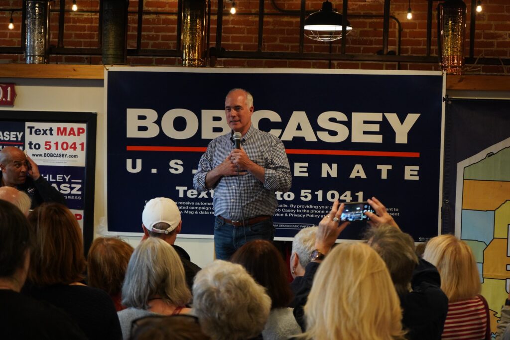 Bob Casey speaks onstage