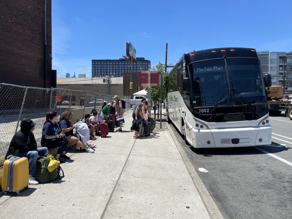 bp-bus-stop-2024-11-15 Passengers wait to board Peter Pan bus