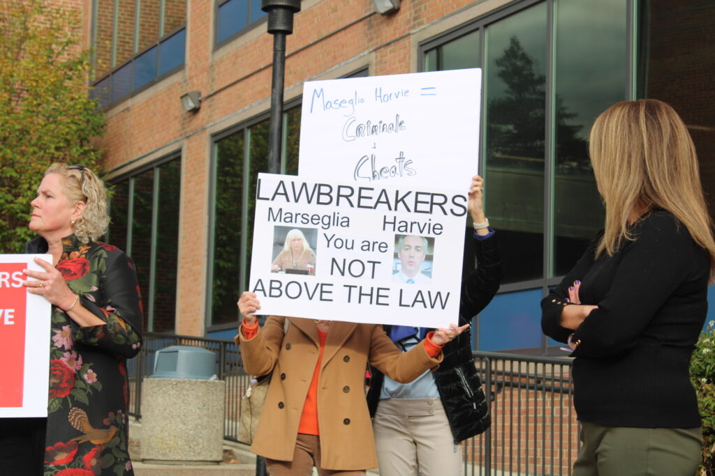 bucks-repubs-2024-11-20 Republicans hold signs condemning commissioners