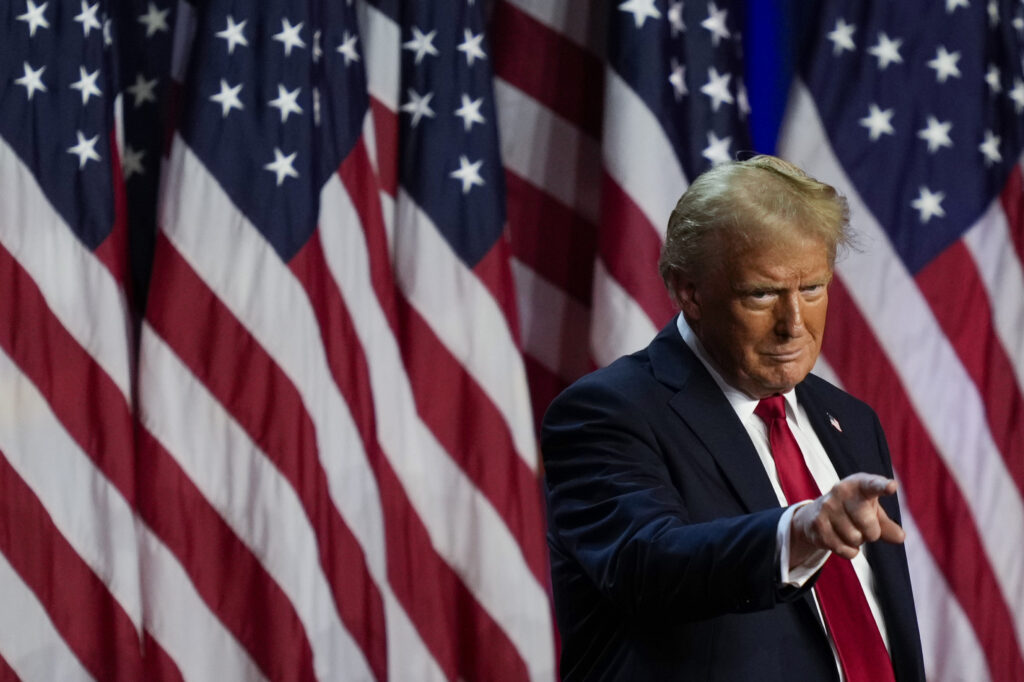 APTOPIX Election 2024 Trump Republican presidential nominee former President Donald Trump points to the crowd at an election night watch party, Wednesday, Nov. 6, 2024, in West Palm Beach, Fla.
