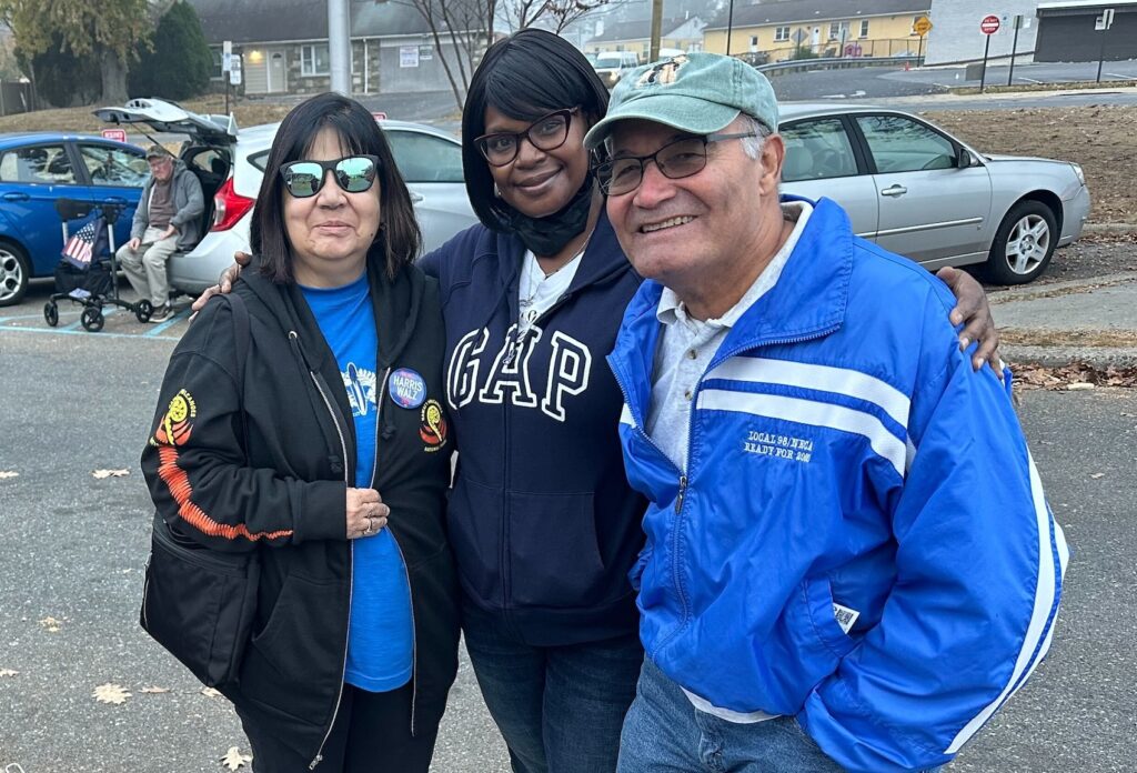 Carol Rodriguez (left), Lynette Willis (center) and Fidel Rodriguez appear outside their polling location in Philadelphia