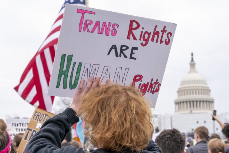 People attend a rally as part of Transgender Day of Visibility at the U.S. Capitol