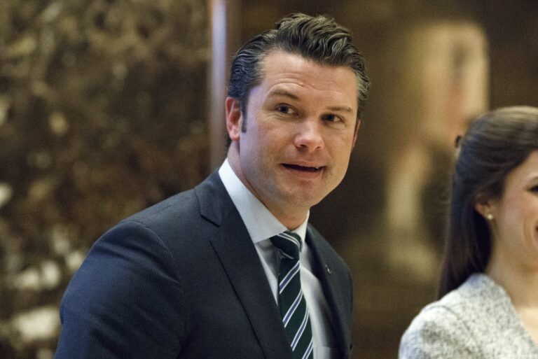 Pete Hegseth walks to an elevator for a meeting with President-elect Donald Trump at Trump Tower in New York, Dec. 15, 2016.
