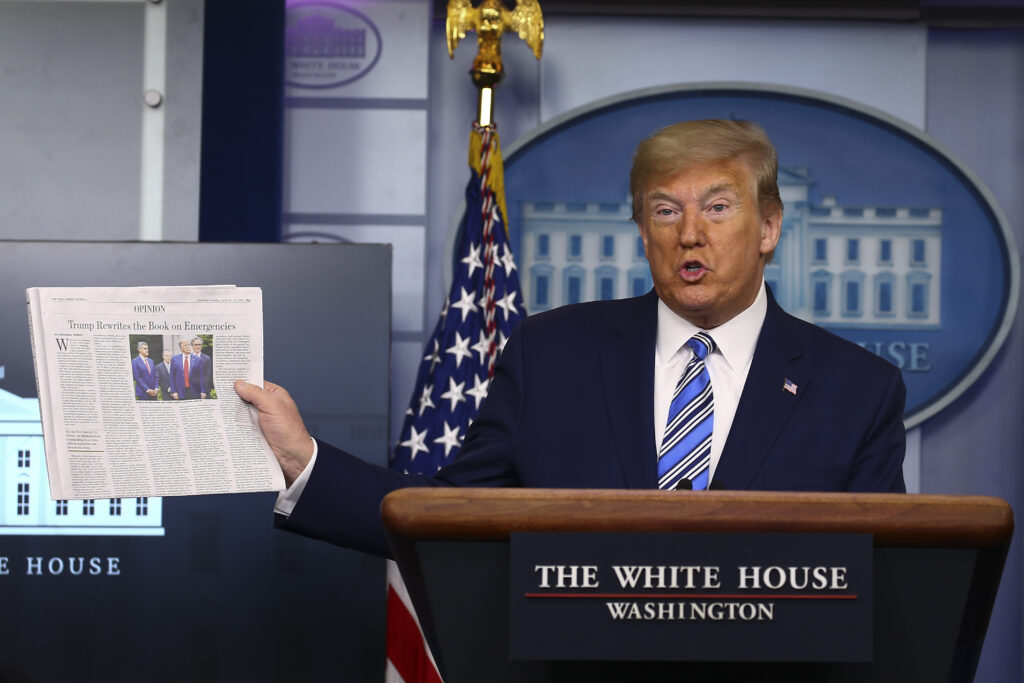 The White House Holds Daily Briefing On Coronavirus Pandemic Donald Trump at a podium