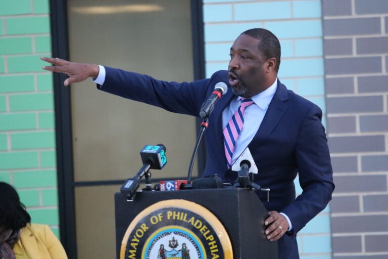 Kenyatta Johnson speaks behind a podium