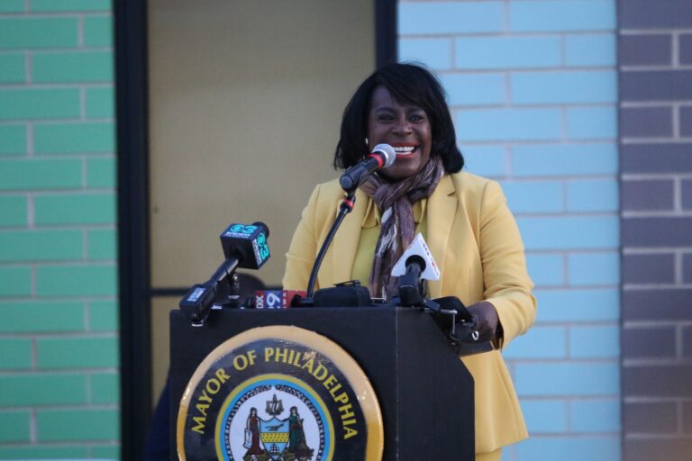 Mayor Parker speaks behind a podium