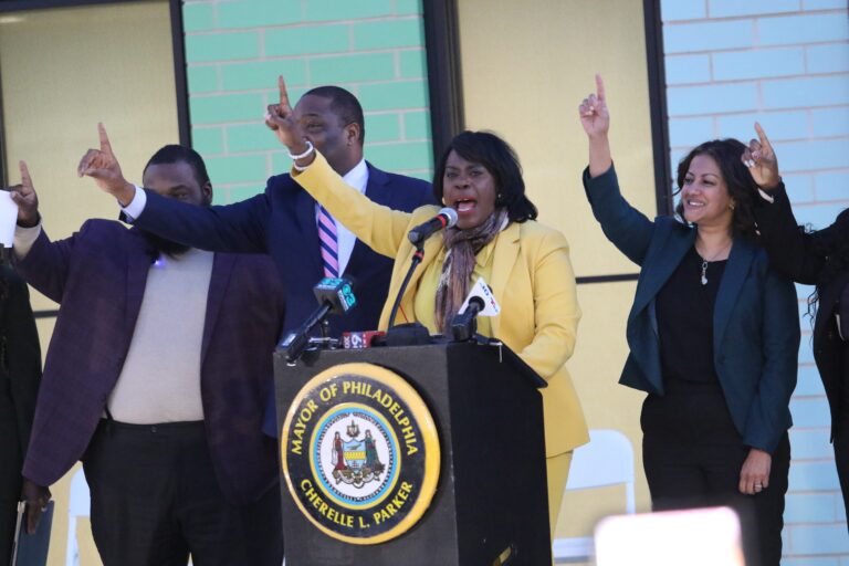 Mayor Cherelle Parker and others holding up a finger