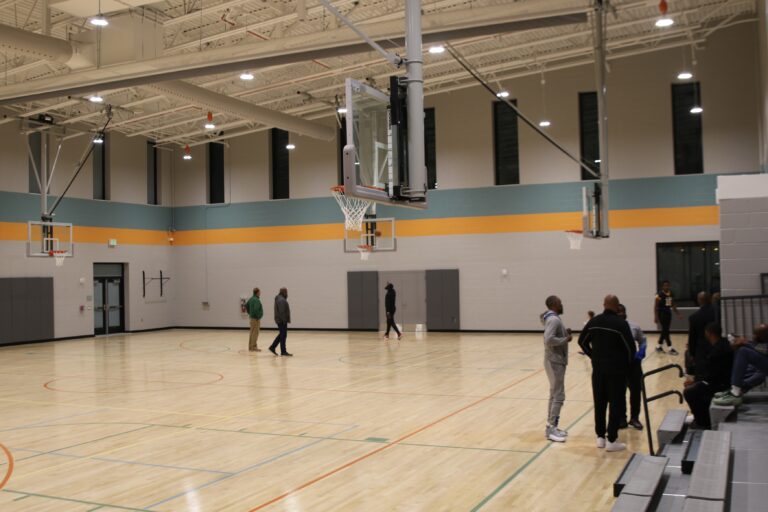 a gymnasium with basketball hoops