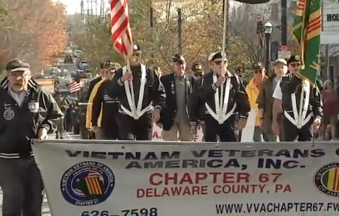 veterans-day-parade-media-pennsylvania-2024-11-11 Veterans hold a banner reading VIETNAM VETERANS AMERICA INC. CHAPTER 67 DELAWARE COUNTY, PA