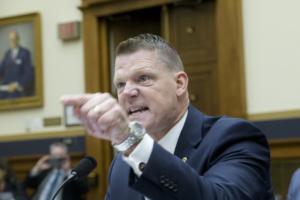 Attemped Assassination Ronald L. Rowe Jr. points a finger angrily