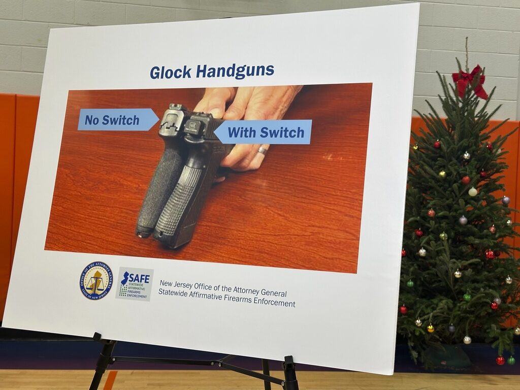 Gunmaker-Lawsuit New Jersey Attorney General Matt Platkin's office displays a photo of a so-called Glock switch in Newark, N.J. on Thursday, Dec. 12, 2024, (AP Photo/Mike Catalini)