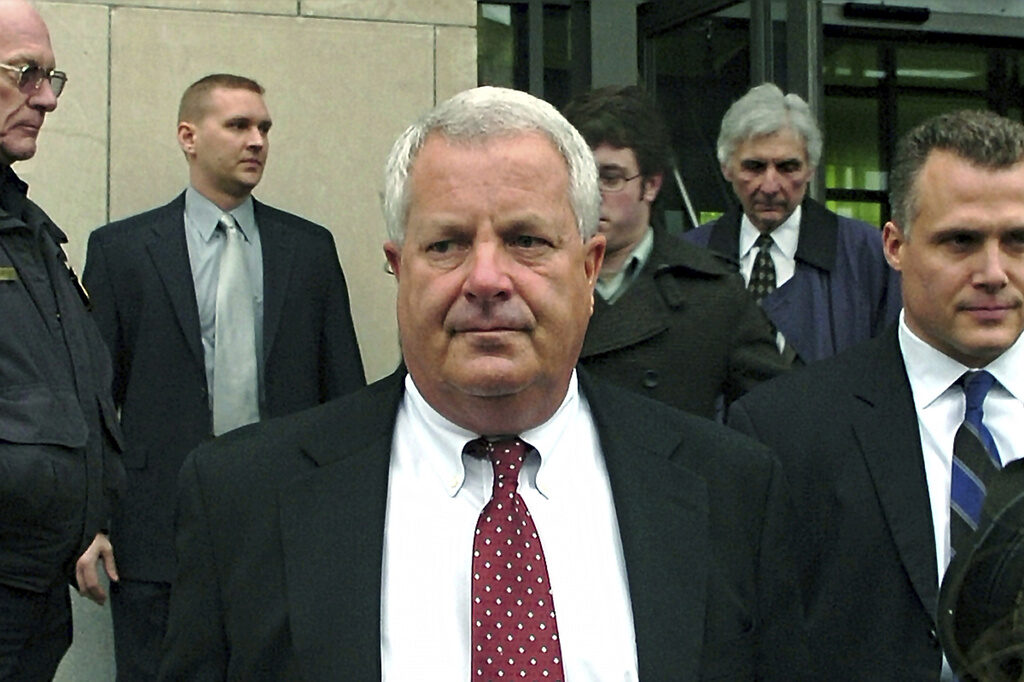Biden Clemency Courthouse Kickbacks FILE - In this Feb. 12, 2009, file photo, Michael Conahan, center, a former Pennsylvania judge involved in a scheme to send youths to a for-profit jail in exchange for kickbacks, leaves the federal courthouse in Scranton, Pa. (AP Photo/David Kidwell, File)