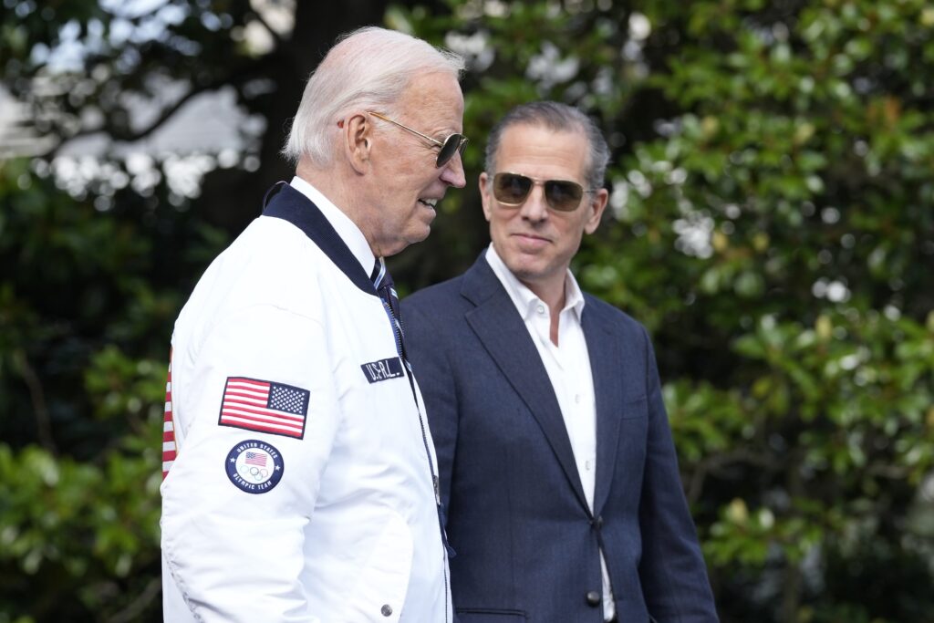 Joe BidenHunter Biden FILE - President Joe Biden, wearing a Team USA jacket and walking with his son Hunter Biden, heads toward Marine One on the South Lawn of the White House in Washington, July 26, 2024. (AP Photo/Susan Walsh, File)